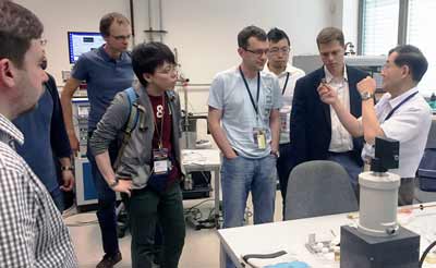 Fig. 1: Prof Yoshizawa (on the right) explains measurement details